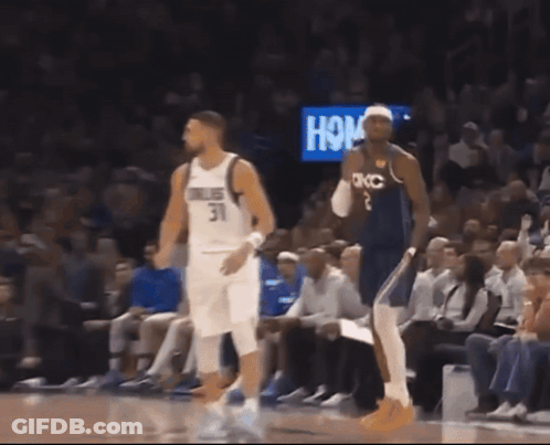 A Basketball Player Wearing A Number 31 Jersey Stands Next To A Player Wearing A Number 2 Jersey GIF