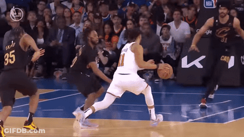 A Basketball Player Wearing A Number 35 Jersey Dribbles The Ball GIF