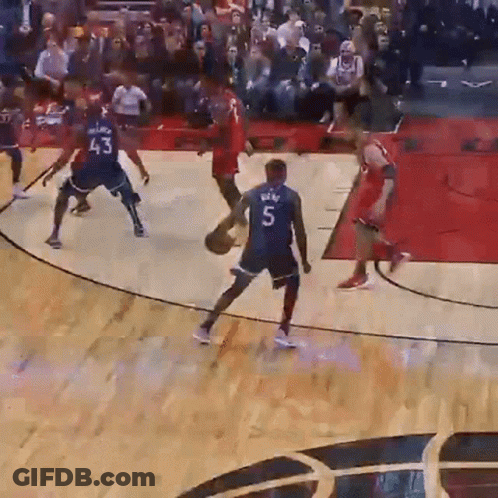 A Basketball Player Wearing A Number 5 Jersey Dribbles The Ball GIF