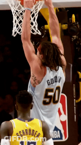 A Basketball Player Wearing A Number 50 Jersey Is Dunking The Ball GIF