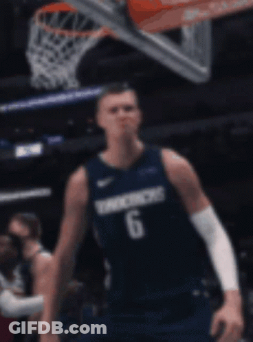 A Basketball Player Wearing A Number 6 Jersey Stands In Front Of A Basketball Net GIF