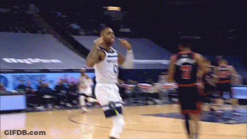 A Basketball Player Wearing A Number 7 Jersey Runs Towards Another Player GIF