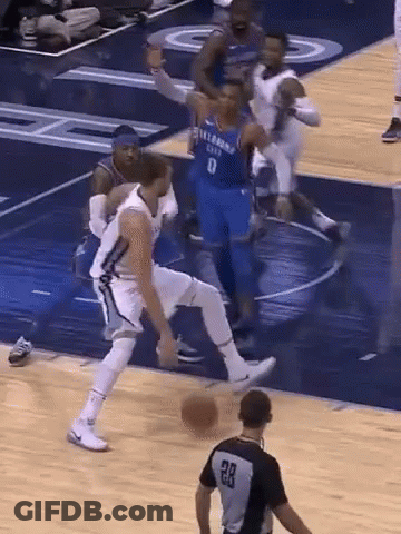 A Basketball Player Wearing A Number 8 Jersey Dribbles The Ball GIF