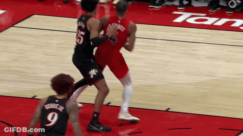 A Basketball Player Wearing A Number 9 Jersey Stands On The Court GIF