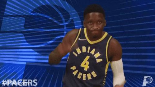 A Basketball Player Wearing A Pacers Jersey Is Clapping GIF