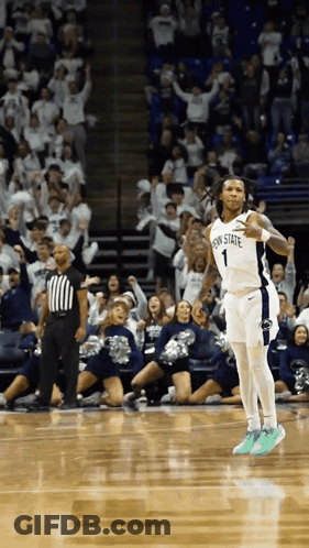 A Basketball Player Wearing A Penn State Jersey Celebrates On The Court GIF