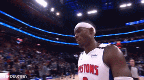A Basketball Player Wearing A Pistons Jersey Stands On The Court GIF