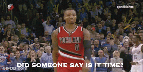 A Basketball Player Wearing A Portland Jersey Is Standing In Front Of A Crowd GIF