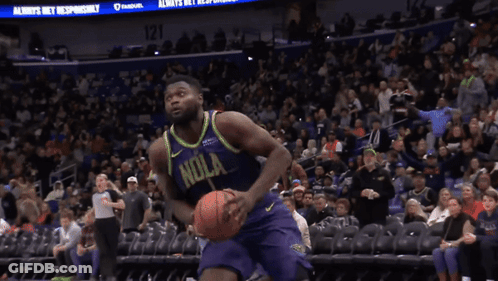 A Basketball Player Wearing A Purple And Yellow Jersey That Says ' Nola ' On It GIF