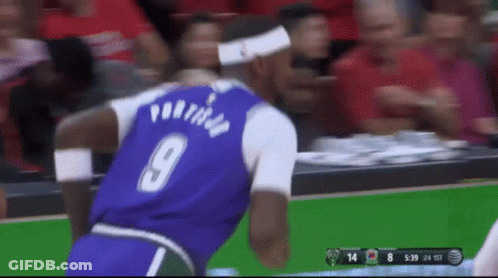A Basketball Player Wearing A Purple Jersey With The Number 9 On The Back GIF