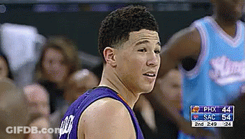 A Basketball Player Wearing A Purple Shirt With The Number 44 On It GIF