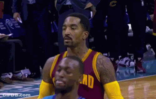 A Basketball Player Wearing A Red And Gold Jersey With The Word End On The Front GIF