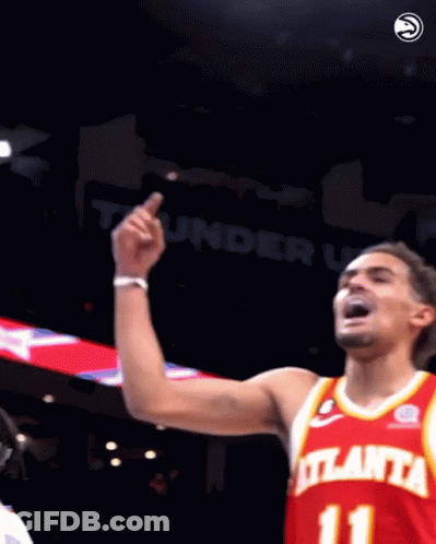 A Basketball Player Wearing A Red Atlanta Jersey With The Number 11 On It GIF