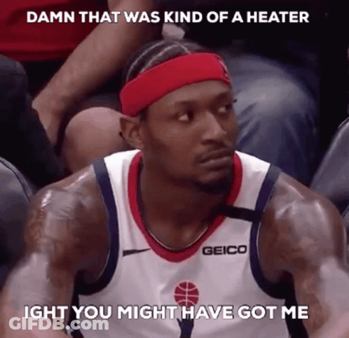 A Basketball Player Wearing A Red Headband And A Geico Jersey GIF