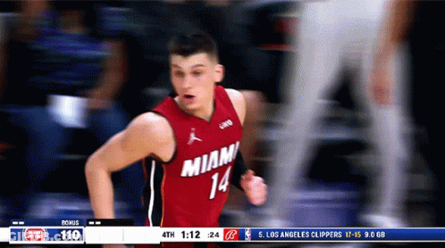A Basketball Player Wearing A Red Jersey That Says Miami 14 GIF