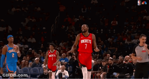 A Basketball Player Wearing A Red Jersey That Says Rockets On It GIF