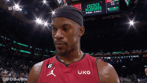 A Basketball Player Wearing A Red Jersey That Says Ukg On It GIF