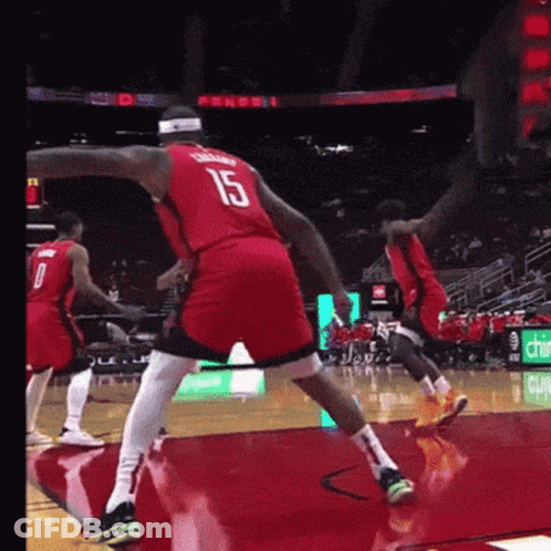 A Basketball Player Wearing A Red Jersey With The Number 15 On It GIF