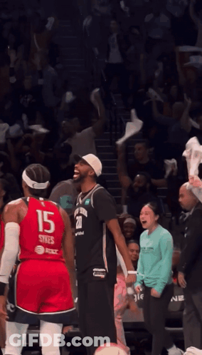 A Basketball Player Wearing A Red Jersey With The Number 15 On It GIF