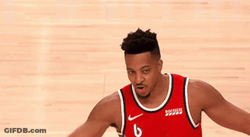A Basketball Player Wearing A Red Jersey With The Number 6 On It Is Standing On A Basketball Court . GIF