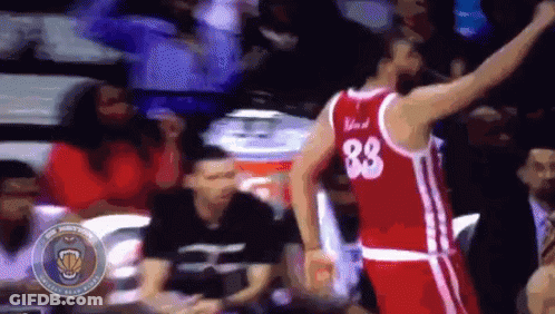A Basketball Player Wearing A Red Jersey With The Number 88 On The Back GIF