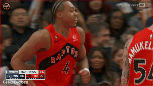 A Basketball Player Wearing A Red Raptors Jersey Is Celebrating GIF