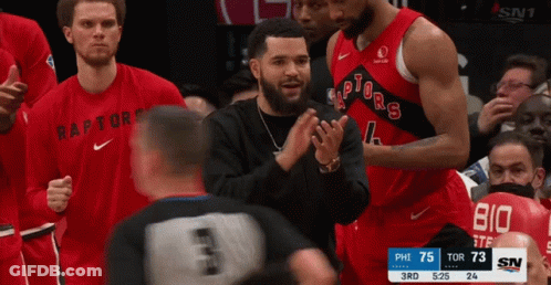 A Basketball Player Wearing A Red Raptors Jersey GIF