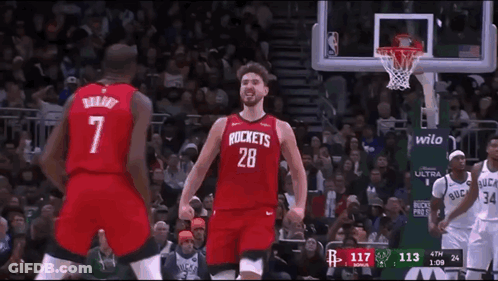 A Basketball Player Wearing A Red Rockets Jersey GIF