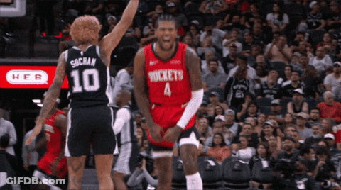 A Basketball Player Wearing A Rockets Jersey Is Celebrating GIF