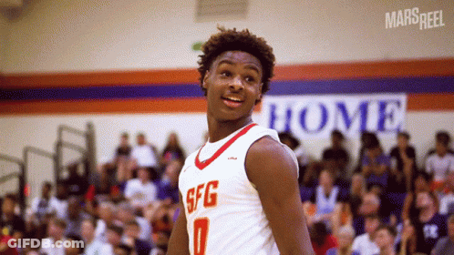 A Basketball Player Wearing A Sfg Jersey Stands In Front Of A Crowd GIF