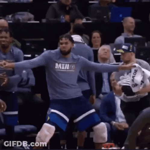 A Basketball Player Wearing A Shirt That Says Minnesota GIF
