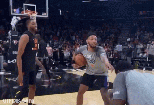 A Basketball Player Wearing A Shirt That Says Suns Is Dribbling The Ball GIF