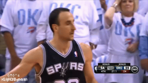 A Basketball Player Wearing A Spurs Jersey Stands In Front Of Fans GIF