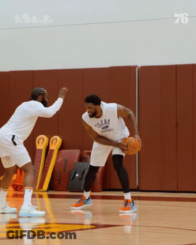 A Basketball Player Wearing A Tigers Jersey Is Dribbling The Ball GIF