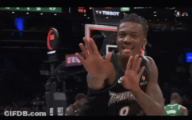 A Basketball Player Wearing A Timberwolves Jersey Is Clapping GIF