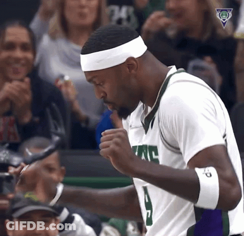 A Basketball Player Wearing A White Headband With The Number 24 On It Stands In Front Of A Crowd GIF