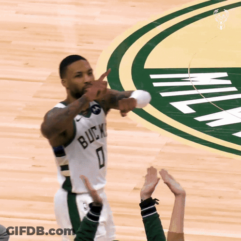A Basketball Player Wearing A White Jersey That Says Bucks 0 GIF
