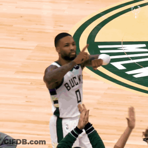 A Basketball Player Wearing A White Jersey With The Number 0 GIF