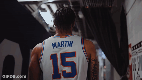 A Basketball Player Wearing A White Jersey With The Number 15 On It GIF