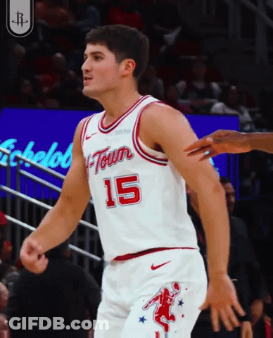 A Basketball Player Wearing A White Jersey With The Number 15 GIF