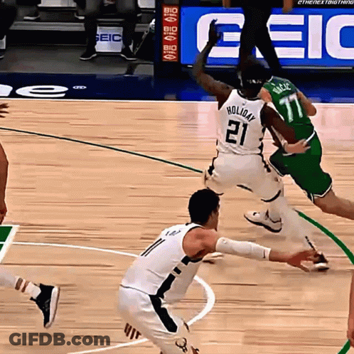 A Basketball Player Wearing A White Jersey With The Number 21 On It GIF