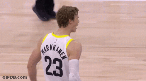 A Basketball Player Wearing A White Jersey With The Number 23 On It GIF