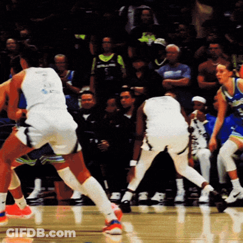 A Basketball Player Wearing A White Jersey With The Number 23 On The Back GIF