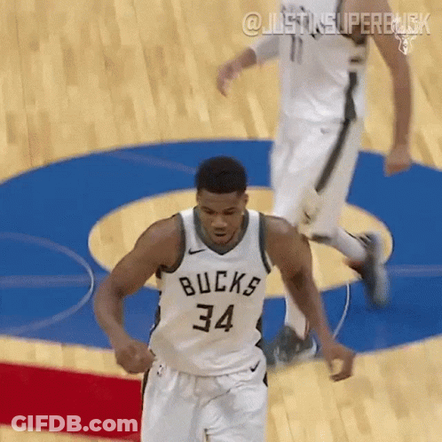 A Basketball Player Wearing A White Jersey With The Number 34 On It GIF