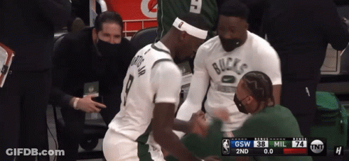 A Basketball Player Wearing A White Shirt That Says Bucks GIF