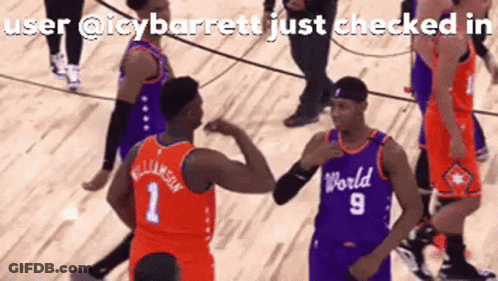 A Basketball Player Wearing A World Jersey High Fives Another Player On The Court GIF