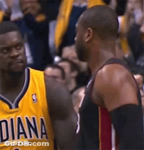 A Basketball Player Wearing A Yellow Diana Jersey Talks To Another Player GIF