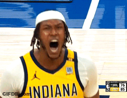 A Basketball Player Wearing A Yellow Indiana Jersey Is Yelling GIF