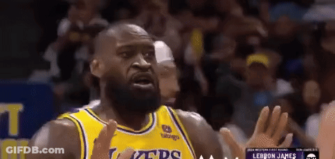 A Basketball Player Wearing A Yellow Jersey That Says Lakers GIF