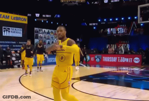 A Basketball Player Wearing A Yellow Jersey With The Number 0 On It Is Running On The Court GIF